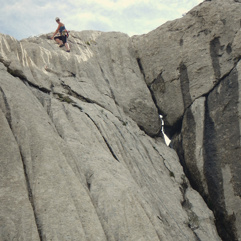 climber at the end of a climbing route